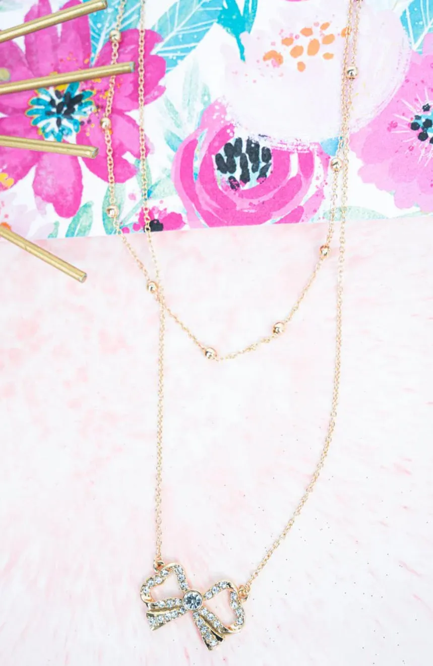 CRYSTAL BOW GOLDTONE LAYERED NECKLACE